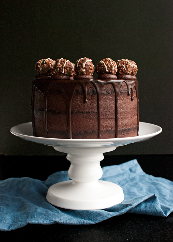 Triple Dark Chocolate Cake - chocolate cake, filled with the best dark chocolate buttercream and topped with chocolate ganache and truffles! | thetoughcookie.com
