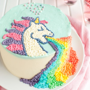 Puking Unicorn Cake - This cake is sooo much fun, and the buttercream design on top is pretty easy if you use a template! | thetoughcookie.com