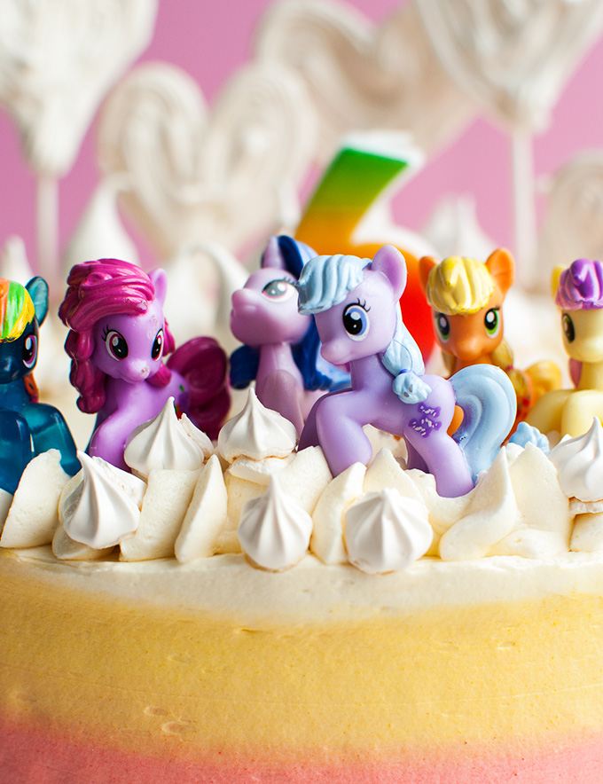 Super Cute My Little Pony Cake - This cake with My Little Pony figures and a rainbow is pretty easy to make at home compared to most My Little Pony cakes out there, but kids love it nonetheless! | thetoughcookie.com