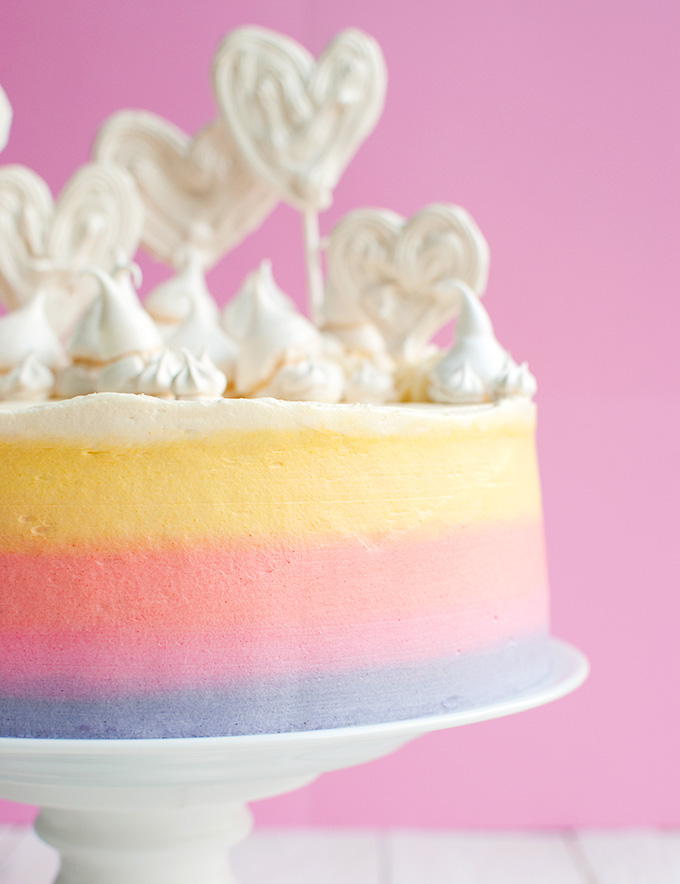 Pastel Rainbow Meringue Heart Cake | This delicious vanilla cakes makes the BEST birthday cake. It's big, fun and so delicious! Great for Valentine's Day, too! | thetoughcookie.com