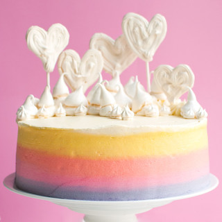 Pastel Rainbow Meringue Heart Cake | This delicious vanilla cakes makes the BEST birthday cake. It's big, fun and so delicious! Great for Valentine's Day, too! | thetoughcookie.com
