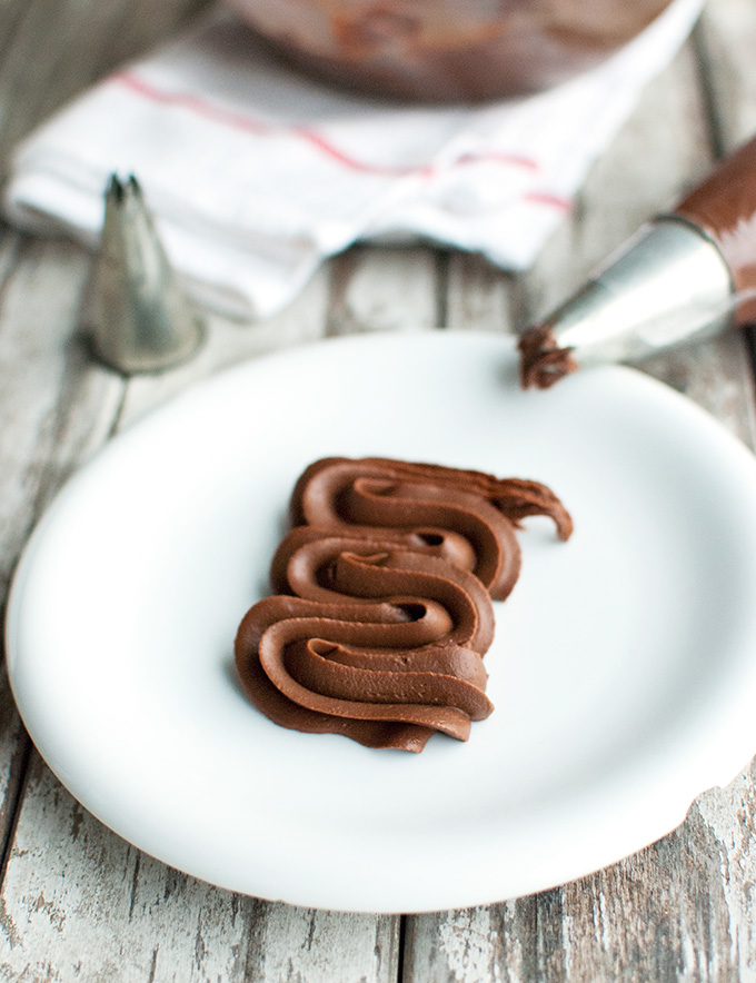 Dark Chocolate Crémeux, or the BEST chocolate frosting ever! It's super smooth, incredibly creamy and deliciously fudgy. And it has an intense chocolate flavor! | thetoughcookie.com